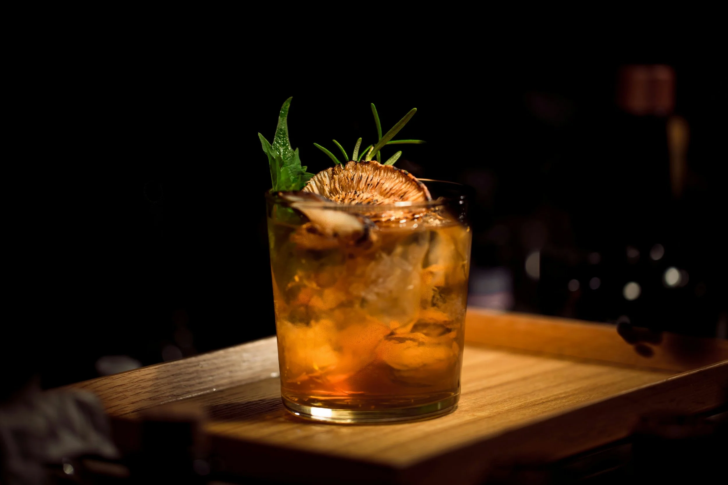 A finished cocktail on the bar top