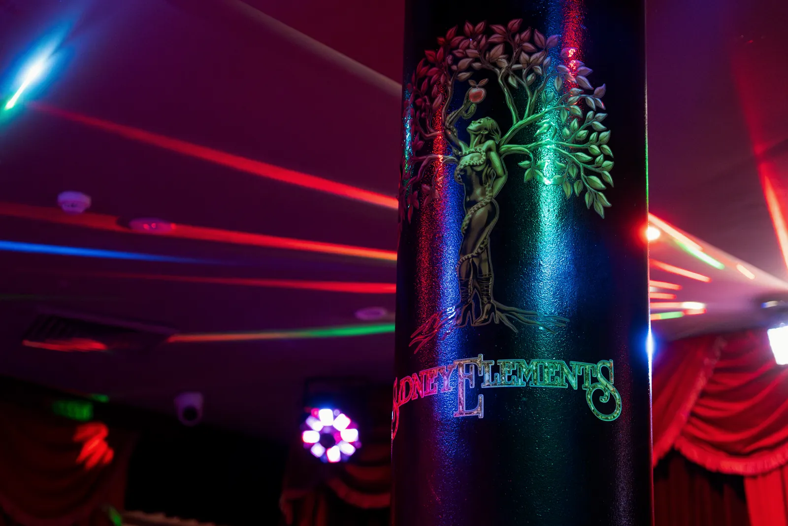 The emblem column with lasers overhead